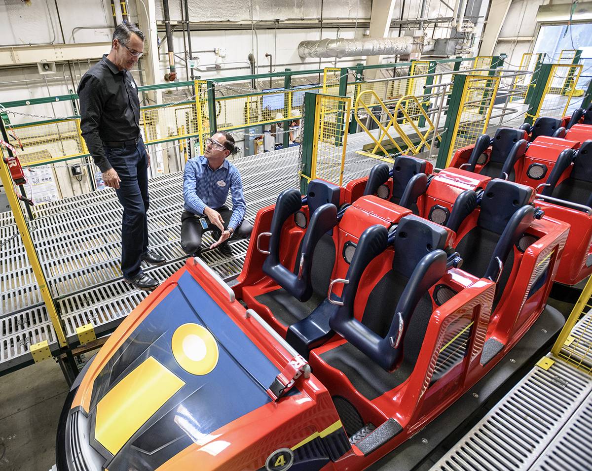 Trevor Larsen examining a rollercoaster