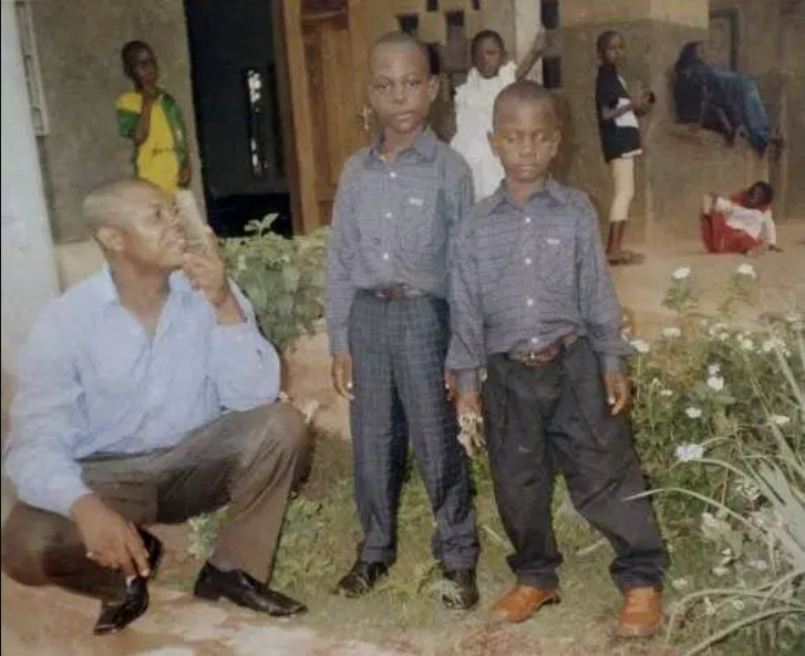 Ndeh as a child with his father and brother in Cameroon