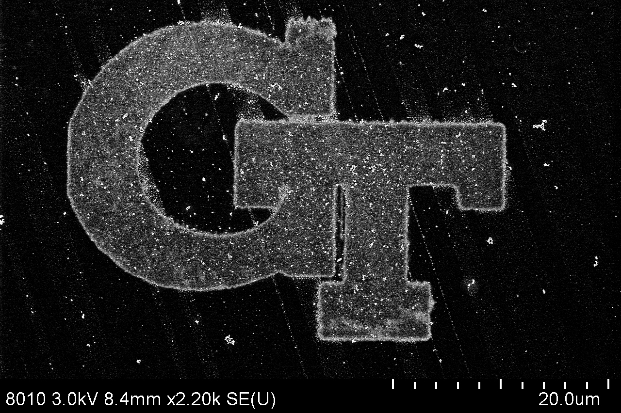 Scanning electron microscope image of a printed silver Georgia Tech logo made with the researchers' SLP technique.