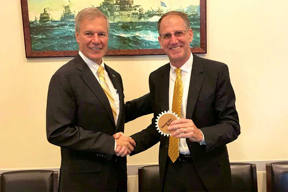 President Bud Peterson presents a coaster to Dave Sienicki President Bud Peterson presents a coaster to Dave Sienicki