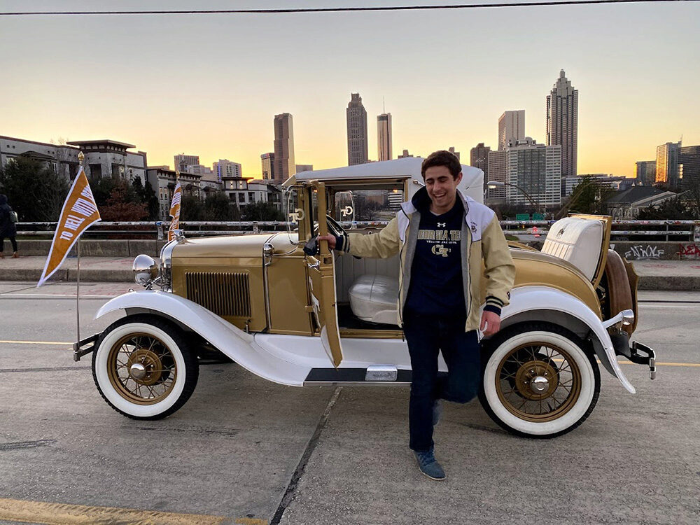 Ethan Rosman exits the Reck with the Atlanta skyline in the background