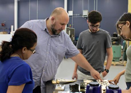 Aaron Stebner (second from left), associate professor in the College of Engineering, leads a lab session with students in the Delta Air Lines Advanced Manufacturing Pilot Facility at Georgia Tech. (Photo: Christa M. Ernst)
