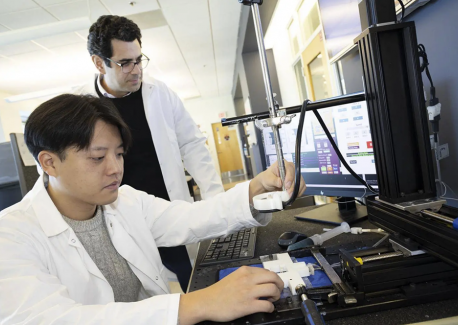 Associate Professor Costas Arvanitis and mechanical engineering Ph.D. student Hohyun "Henry" Lee 