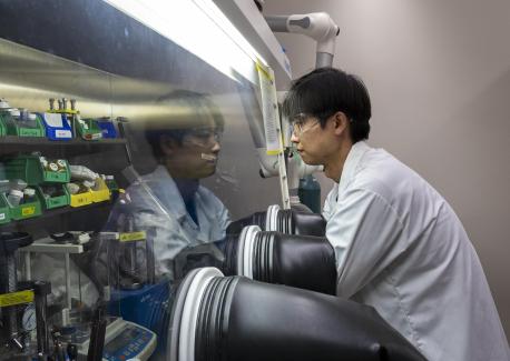 Sun Geun Yoon works in a glove box in McDowell’s laboratory at Georgia Tech.